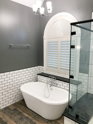 bathroom remodel with freestanding tub and subway tile
