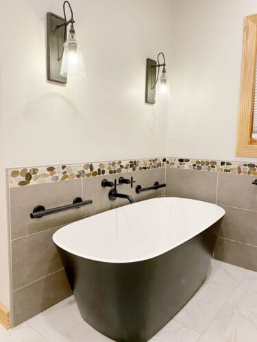 bathroom remodel with freestanding tub with black shell