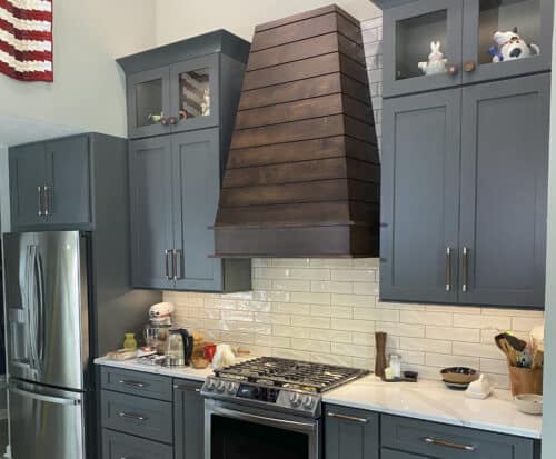 kitchen remodel with walnut wood rangehood