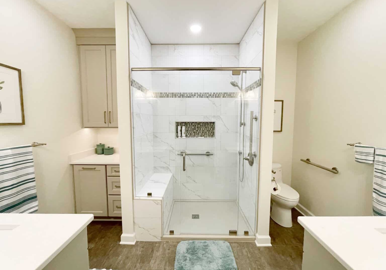 bathroom remodel with low entry onyx shower base and cabinet hamper