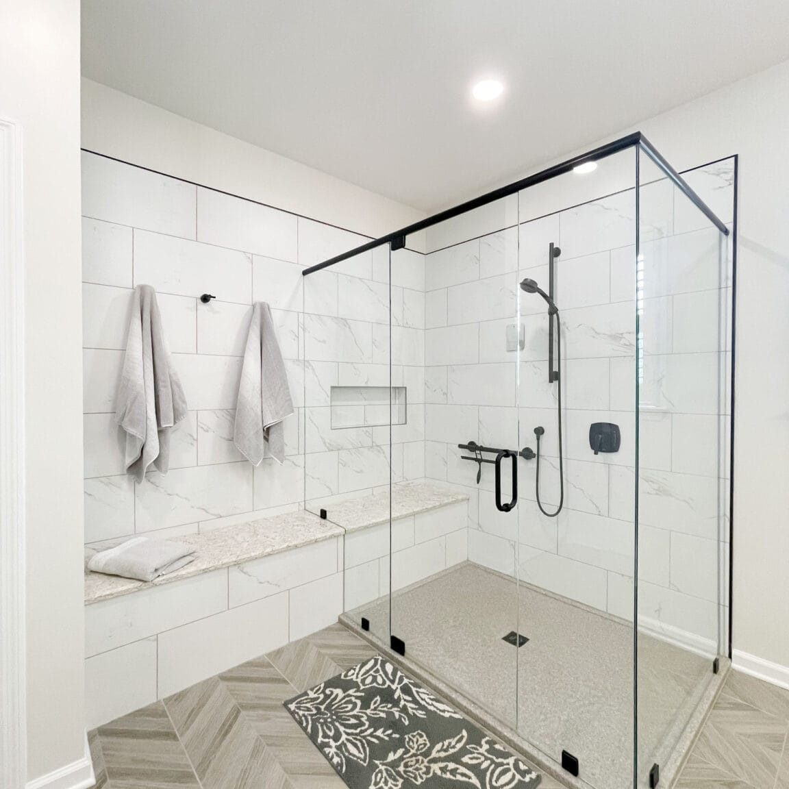 gladeville bathroom remodel with large onyx collection shower base and long bench