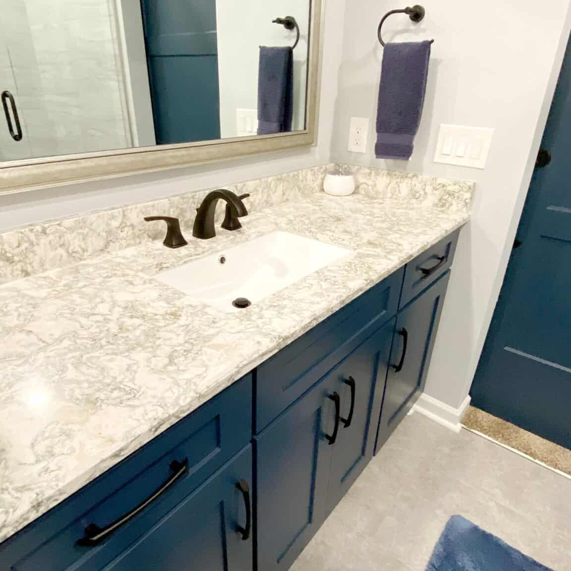 hermitage bathroom remodel with navy blue vanity