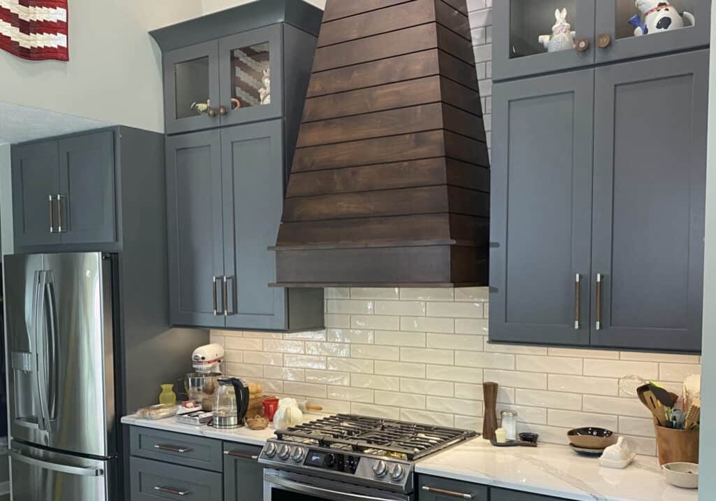 kitchen remodel with walnut wood rangehood