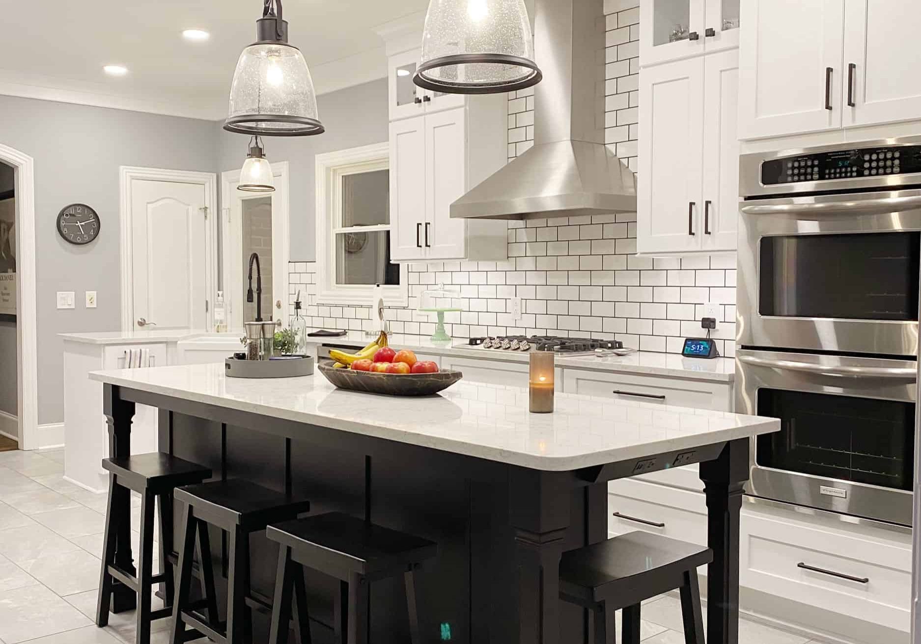 Kitchen-Remodel-with-White-Cabinets-and-Black-Island kitchen remodel with white cabinets and black island