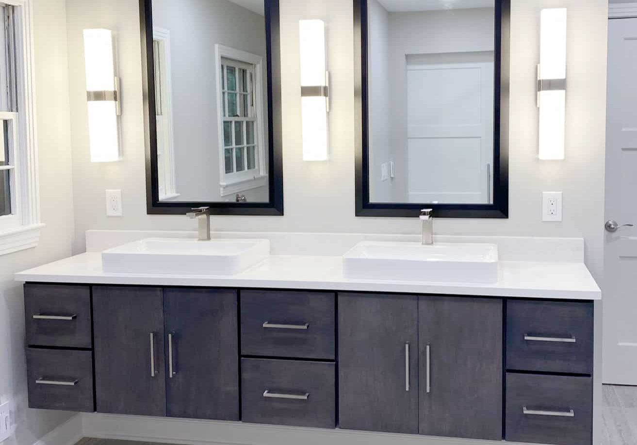 old hickory bathroom remodel with floating vanity and led sconces